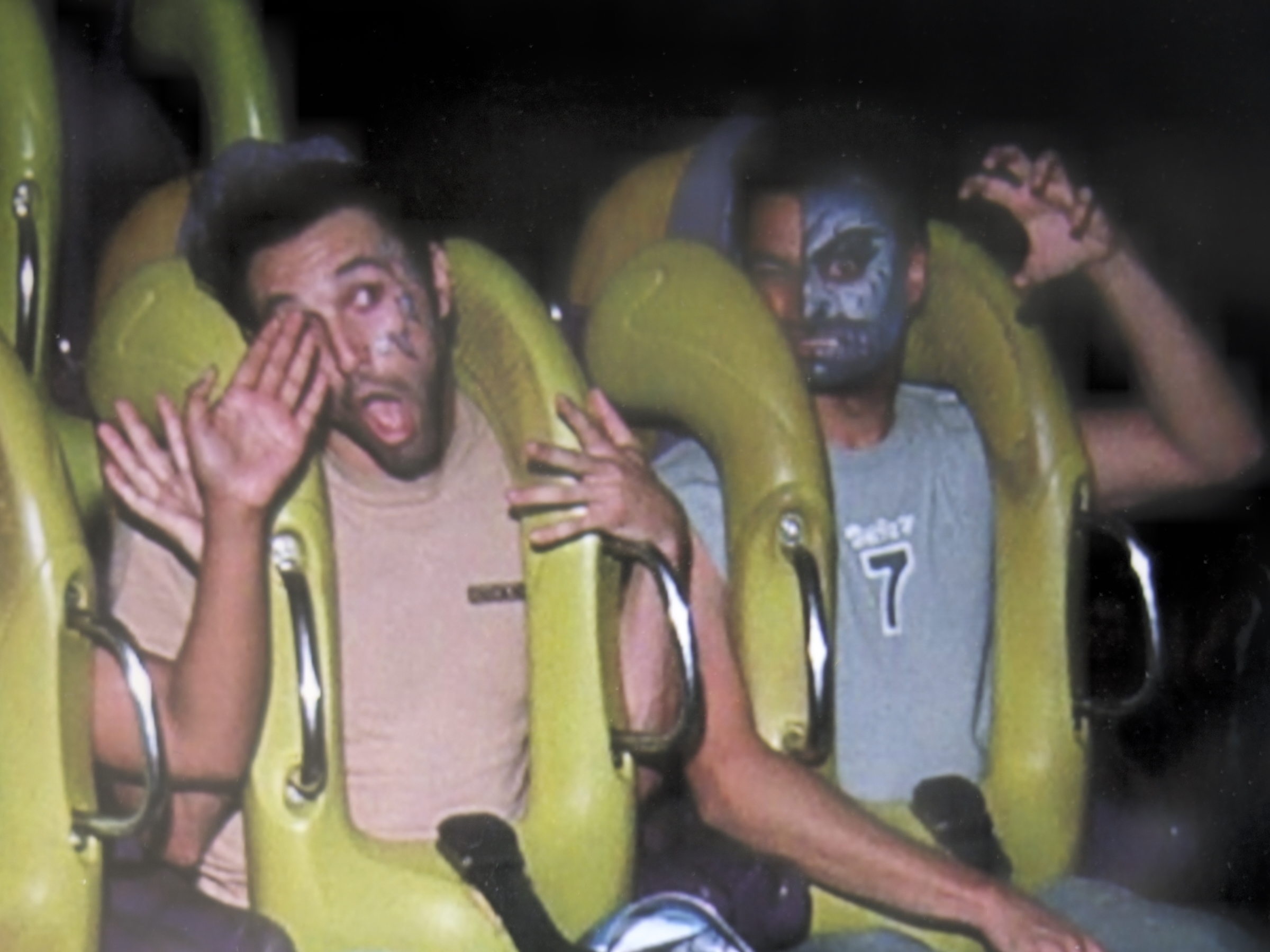 Jesse and bff on a roller coaster at Six Flags in 2008, having fun with face paint and making silly faces.